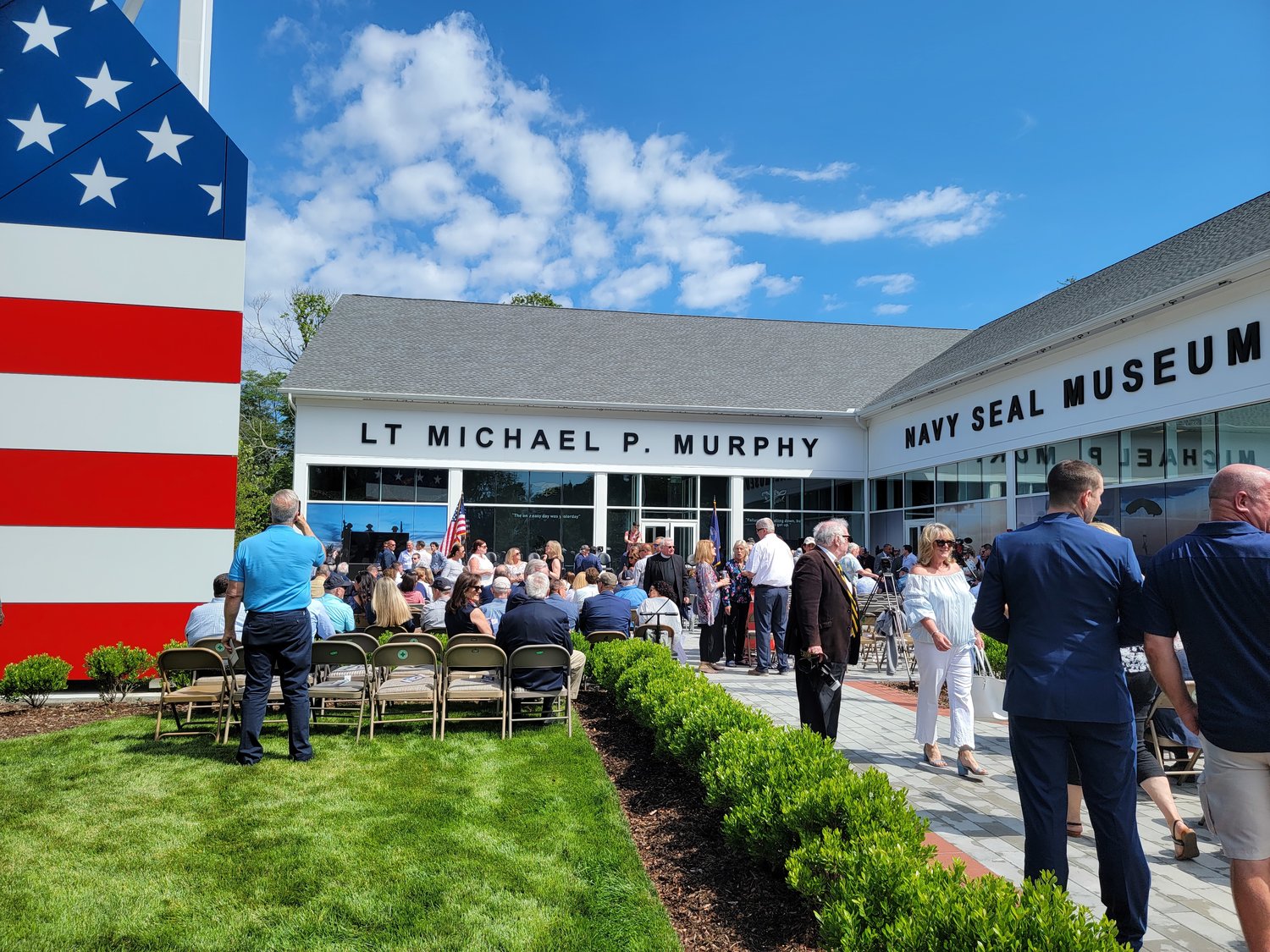 Over 1,000 attendees came to the ribbon cutting of the Lt. Michael Murphy Navy SEAL Museum. The crowd was treated to a special descent by the Navy’s Leapfrog team, who parachuted down to the West Sayville Golf Course driving range, next door to the museum.